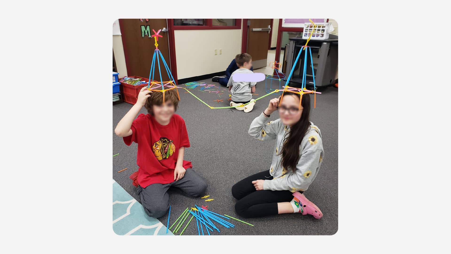 A pair makes a wearable idea catching machine in Sara Ebert's library.