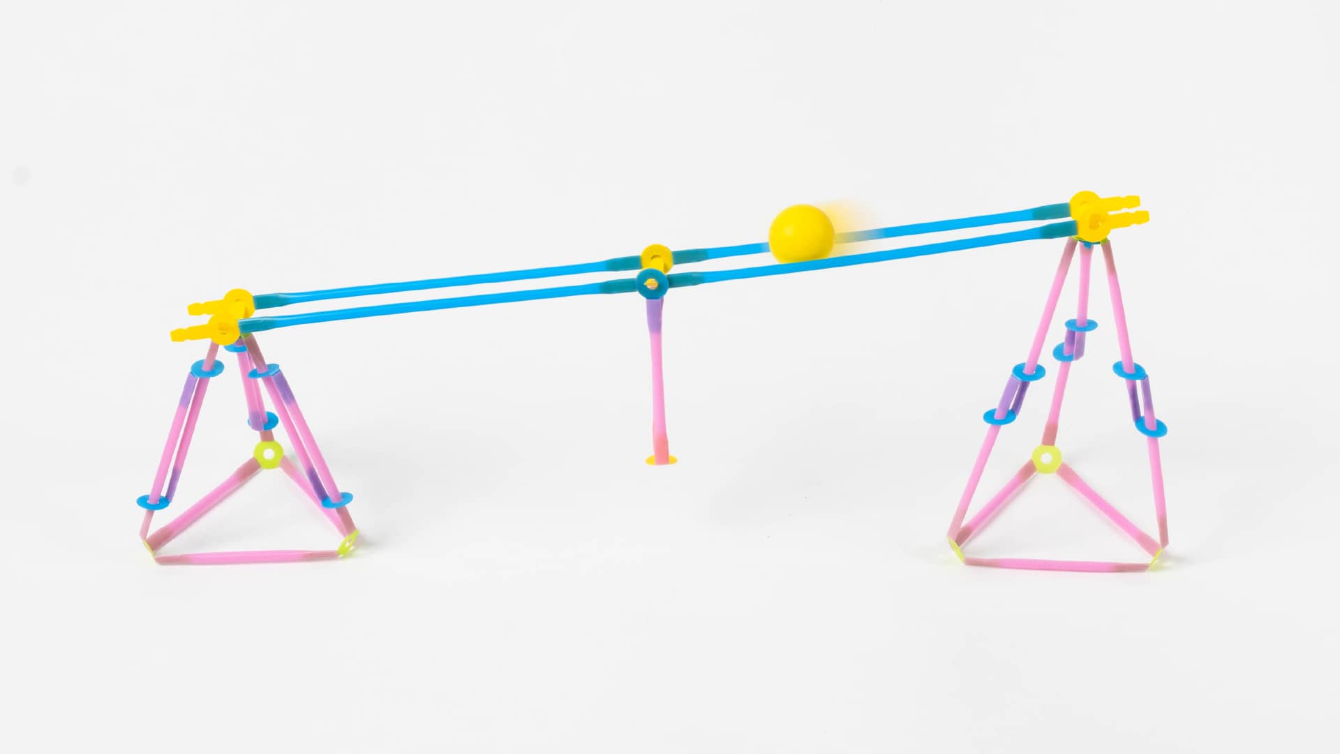 By expanding the sliding beams slightly, the ball will roll slower. While the path will be clear, the conversion of potential to kinetic energy will not be enough for motion.