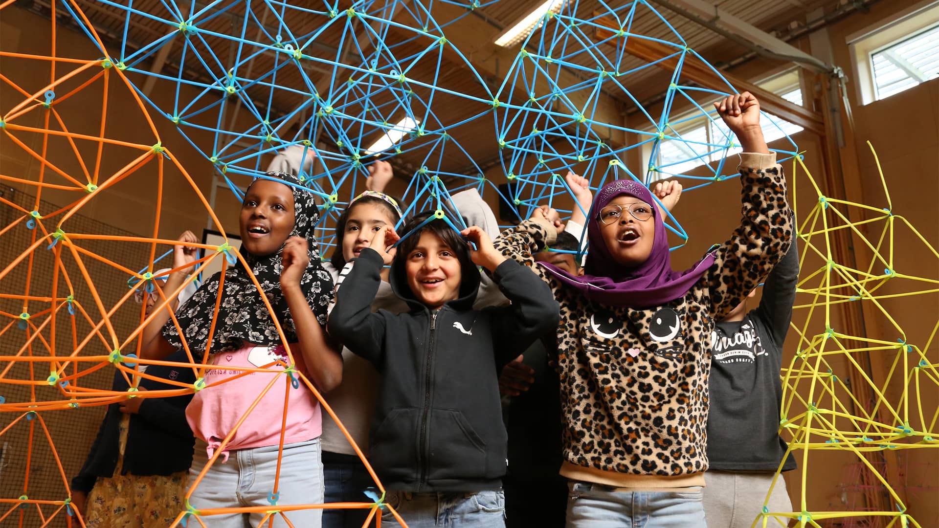 The Sierpinski Pyramid becomes not only a way to learn about self-similarity with geometry and also becomes space children reside inside. The pyramids also become wearable hats.